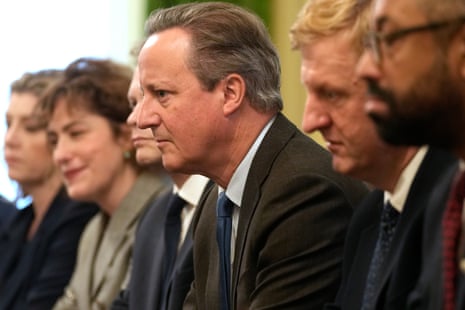 David Cameron (centre) in cabinet, facing Rishi Sunak.