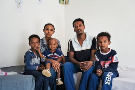 Migrants rescued by Red Cross durring crossing between Libya and Italy. Mineo, Sicily. ITALY Michael Estifannos 28 years old from Eritrea pose for a portrait with his wife and kids.
