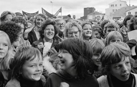 A crowd of women and girls smiling