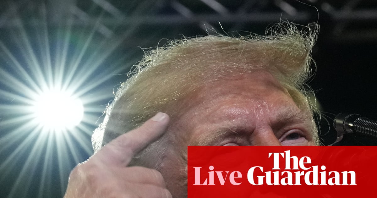 Trump targets Ilhan Omar at rally following raid on her home – US politics live