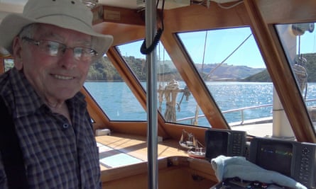 Dick Ledgerwood at the helm of his boat New Zealand.