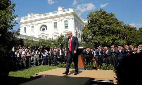 Donald Trump walks away after announcing US withdrawal from the Paris climate agreement, in the Rose Garden of the White House in Washington on 1 June 2017.