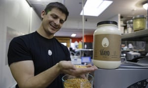 Hampton Creek Foods CEO Josh Tetrick holds a species of yellow pea used to make Just Mayo.