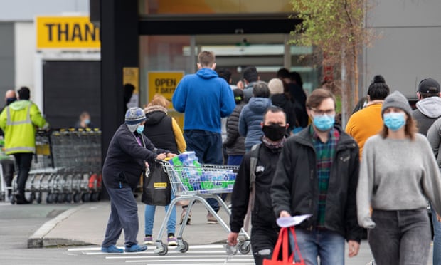 People wearing masks outside a Christchurch supermarket last year