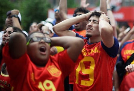 Spain fans react as they watch the match at a fan zone in Boston
