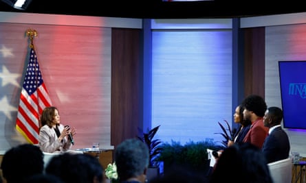 Kamala Harris sits across from three people