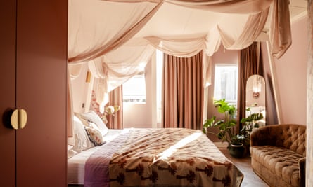 The couple’s bedroom with drapes.