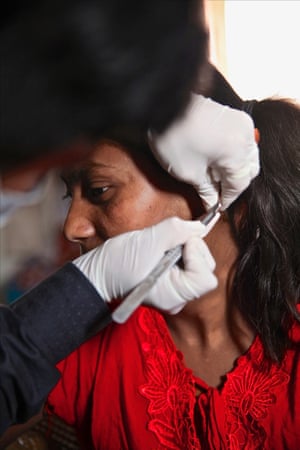 sample being taken from woman's ear