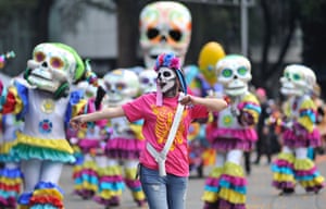 People take part in the Day of the Dead parade in Mexico City