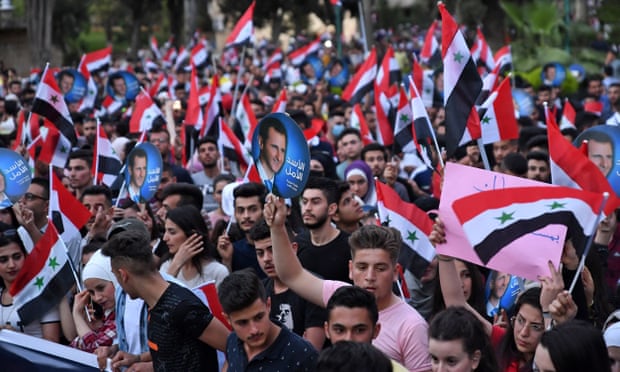 Students march in support of President Bashar al-Assad in Aleppo last week. Photograph: AFP/Getty Images