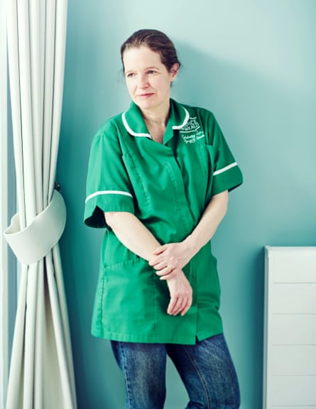 Writer Anna Tims in a green tunic and jeans at the Cottage Hospice in East Sussex.