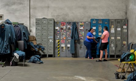 Employees at the Electronics Recyclers International facility in Fresno, California, finish their shift