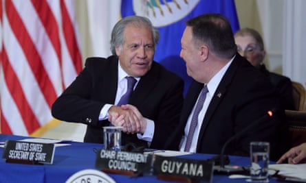 The former US secretary of state Mike Pompeo, right, and the Organization of American States secretary general, Luis Almagro, at an OAS meeting last year, shaking hands