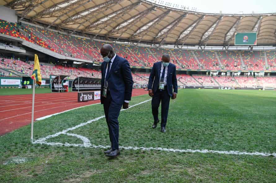 CAF officials inspect the quality of the pitch before the Group E match between Ivory Coast and Algeria.