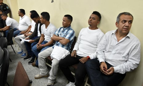 The former manager of Desa Sergio Rodríguez, right, and the seven other people accused of killing the Honduran environmental leader Berta Cáceres, wait to hear their sentence at a courtroom in Tegucigalpa.