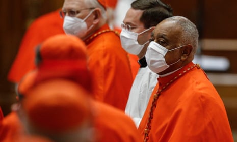 Wilton Gregory, right, the first African American cardinal, wears a protective mask during a consistory ceremony in St Peter’s Basilica at the Vatican City.