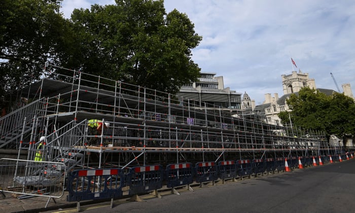 Scaffold platforms under construction opposite Westminster Abbey in preparation for the funeral.