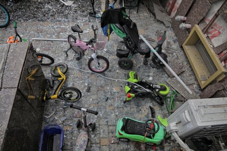 Children's bicycles are seen among debris in a damaged apartment building in Odesa.