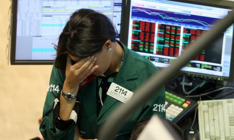 A Lehman Brothers trader holding her head on 15 September 2008, the day the US investment bank filed for Chapter 11 bankruptcy