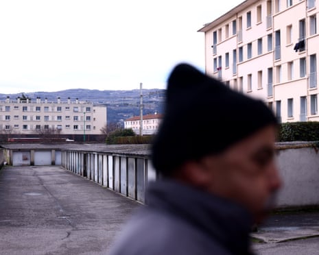 A man walks past a garage where two women were found in Bourg-lès-Valence, in the Drome department, south-eastern France