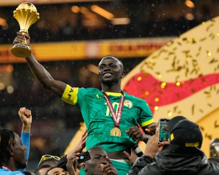 Senegal’s Sadio Mané holds the trophy aloft after the Africa Cup of Nations final in January