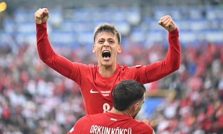 Arda Guler and Orkun Kokcu celebrate during the Euro 2024 group stage match between Turkey and Georgia in Dortmund, Germany