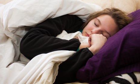 Sick young woman sleeps on couch