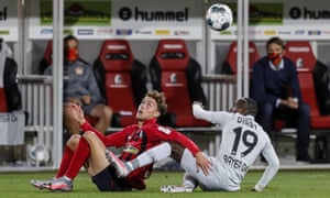 Freiburg’s Luca Waldschmidt (fleft) in action against Bayer Leverkusen’s Moussa Diaby.
