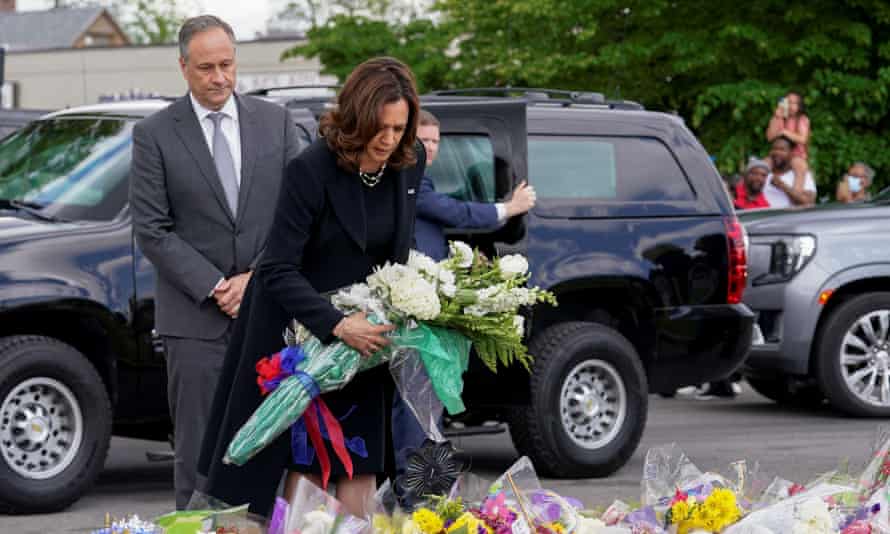 harris holds bouquet with her husband next to her