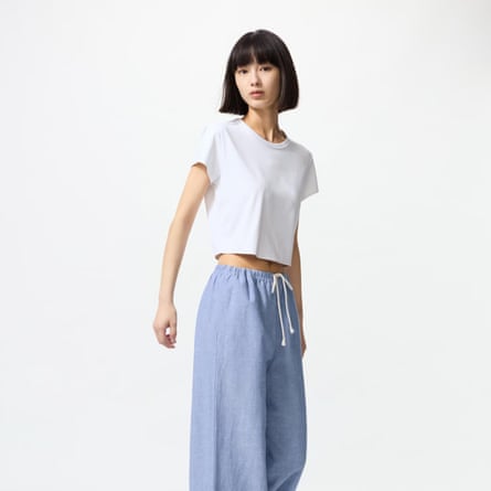 A model wears Uniqlo light blue easy trousers with draw string