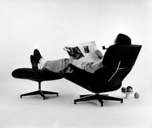 Charles Eames in the plywood Lounge and Ottoman, 1956.