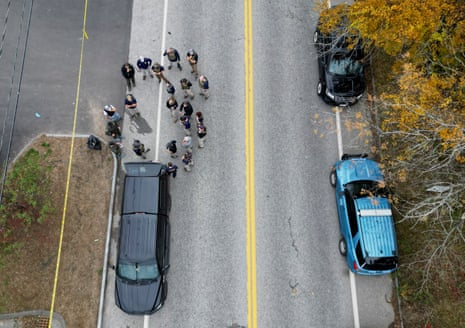 An aerial view of law enforcement personnel at the Schemengees Bar & Grille Restaurant after deadly mass shootings in Lewiston, Maine, U.S. October 26, 2023.