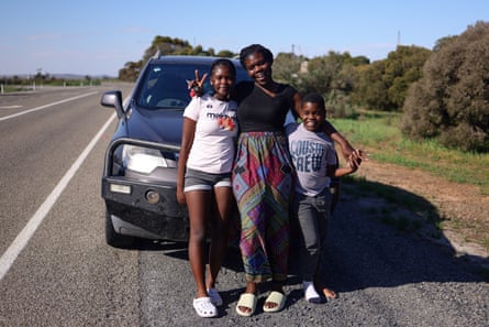 Miranda and her two children in front of their car in South Australia.