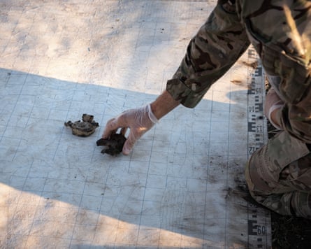 Bones are placed on a diagram of a skeleton to help with identification.