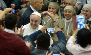 Close up ready … Pope Francis greets the crowds, 1 February.