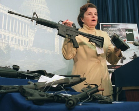 Feinstein holds an AR-15 assault-style rifle on 22 March 1996 after the House voted to repeal the two-year-old assault-style firearms ban.