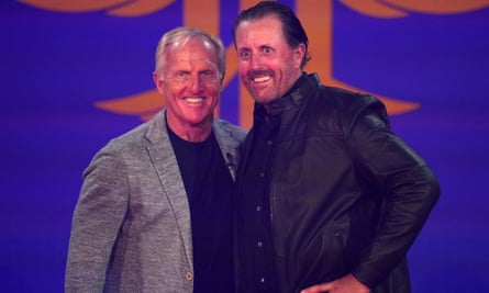 Greg Norman (left) and Phil Mickelson on stage together