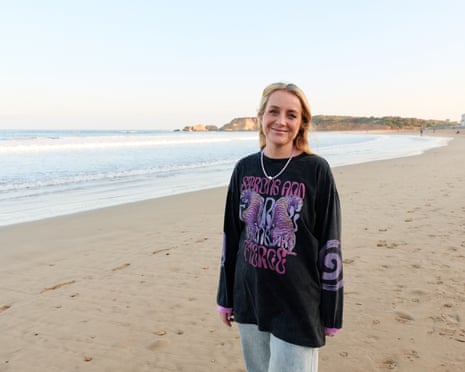 Erin Hughes smiles in an on a beach in Torquay