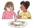 Two children dip vegetable sticks into a bowl of hummus, chatting together