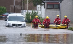 Members of the emergency services in Brechin, Scotland, as Storm Babet battered the country last week.