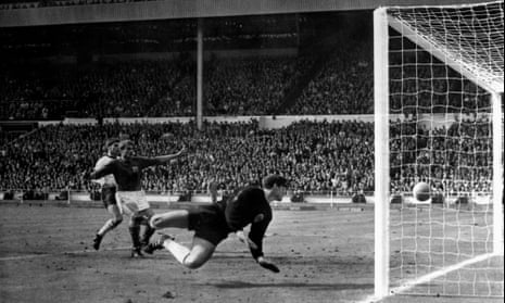 Roger Hunt, arms outstretched, looks on as Geoff Hurst scores via the bar in England’s 1966 World Cup final win over West Germany
