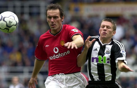 Laurent Blanc challenges Craig Bellamy for the ball in the Premier League clash between Manchester United and Newcastle.