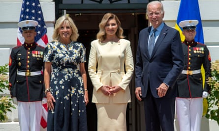 Ukraine’s first lady, Olena Zelenska, centre, wears a lemon Litkovska skirt suit while visiting Joe and Jill Biden in Washington last July.