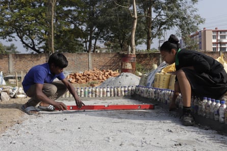 The plastic waste collected from students is stuffed into bottles to make eco-bricks, which are used for building projects.