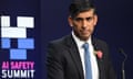 Rishi Sunak speaks on stage in front of a backdrop saying 'AI Safety Summit'