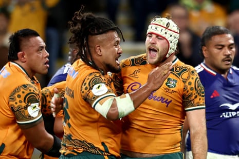 Australia's try scorers celebrate together.