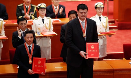Retired Chinese basketball player Yao Ming (right and Baidu’s chief executive officer, Robin Li, attend a meeting held to celebrate the 40th anniversary of China’s reform and opening up at the Great Hall of the People in Beijing.