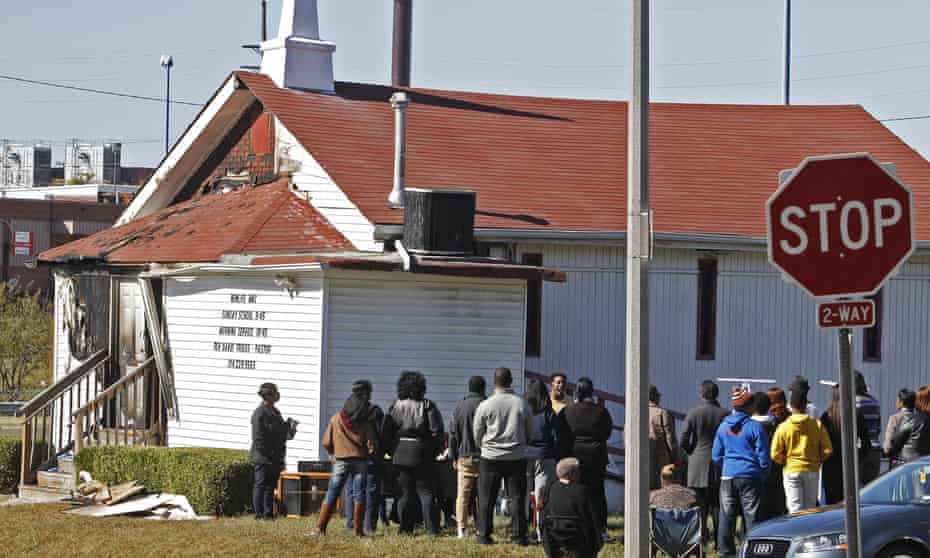 An outdoor service is held following a fire at the New Life Missionary Baptist Church in St Louis. 