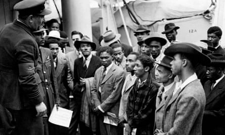 Jamaican immigrants being greeted by RAF officials from the Colonial Office after the Empire Windrush landed them at Tilbury.