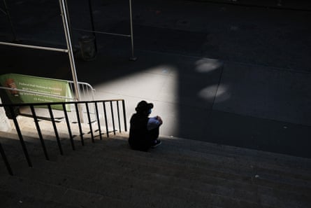 A man pauses in front of the New York Stock Exchange on Wall Street as the coronavirus keeps financial markets and businesses mostly closed.